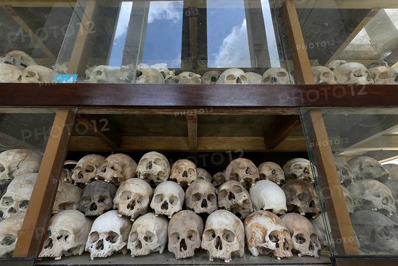 Skulls and bones in the Memorial Stupa to the prisoners murdered by the Communist or Maoist Khmer Rouge in Choeung Ek
