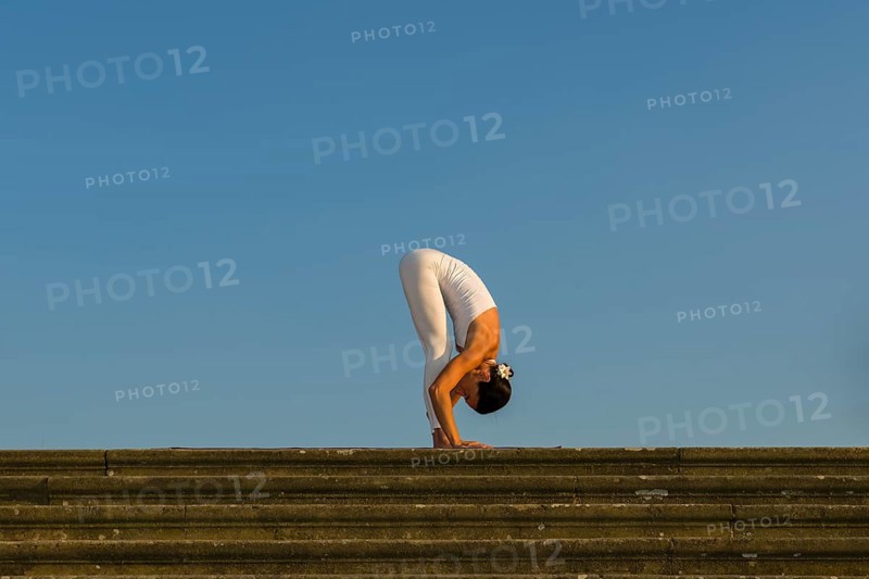 Young woman practising Hatha yoga