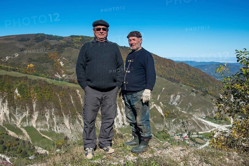Old Chechen men at an overlook in the Chechen mountains