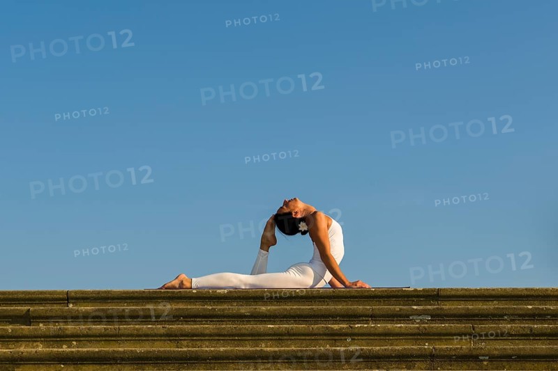 Young woman practising Hatha yoga