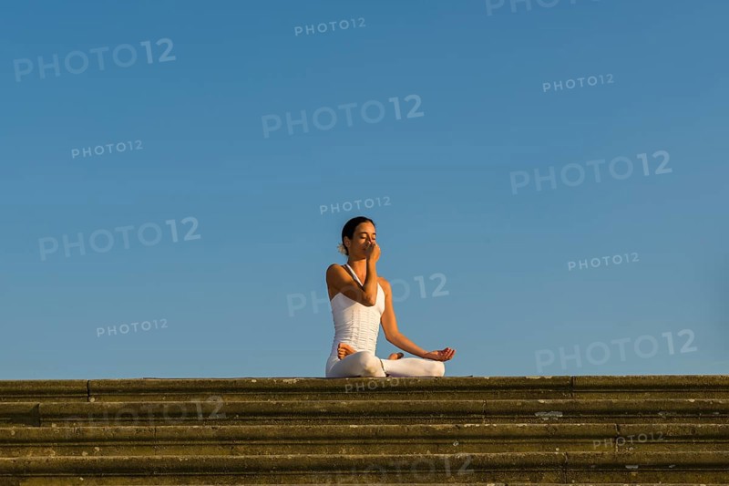 Young woman practising Hatha yoga