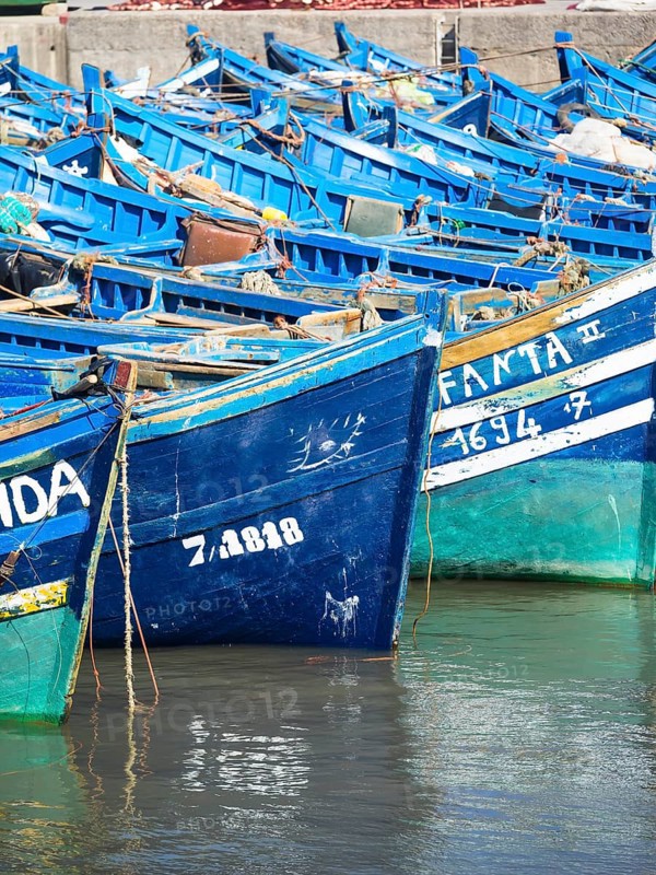 Old blue fishing boats in the port of Essaouira