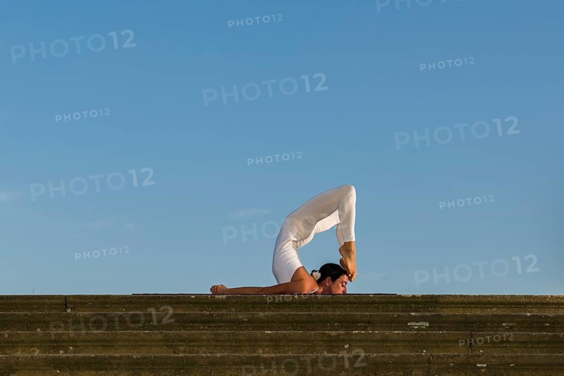 Young woman practising Hatha yoga