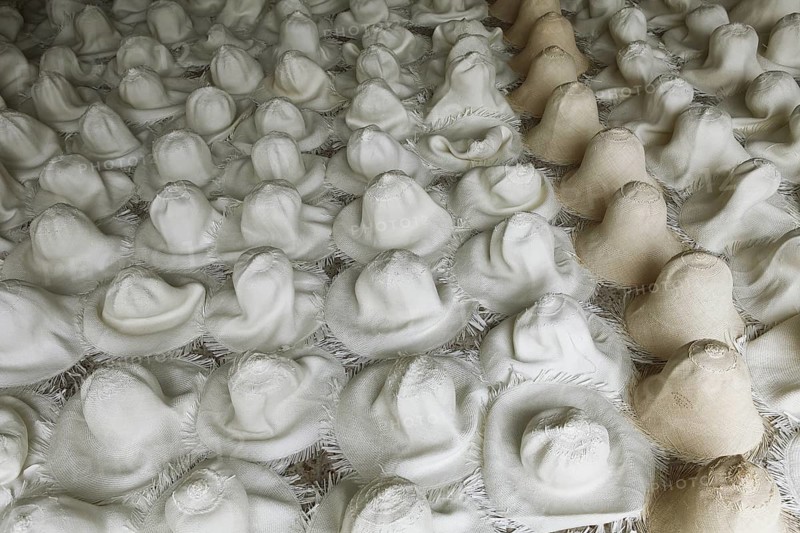Moulded blank Panama hats are left to dry out