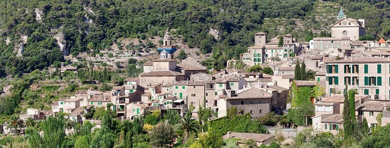 Valldemossa with the Carthusian Valldemossa Charterhouse and the parish church of Sant Bartomeu