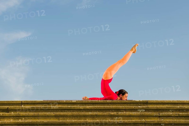 Young woman practising Hatha yoga