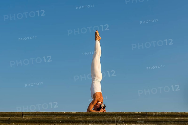 Young woman practising Hatha yoga