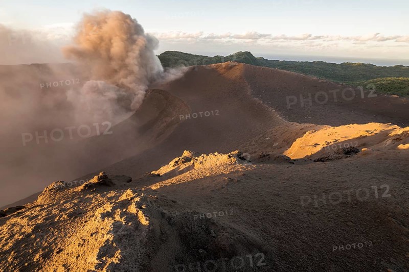 People on the crater rim of Mount Yasur volcano