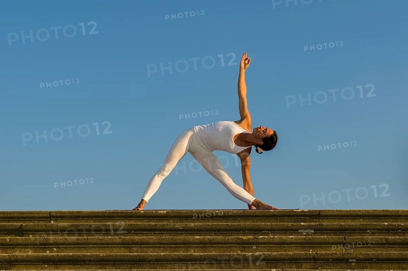 Young woman practising Hatha yoga