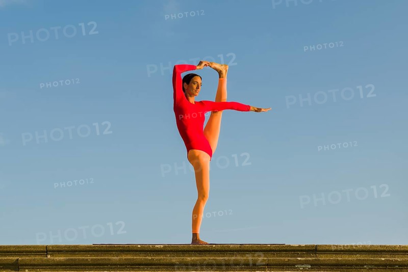 Young woman practising Hatha yoga