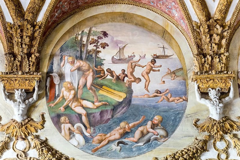 Naked men jump and splash in the water