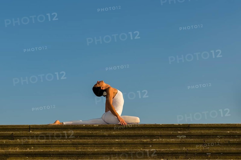 Young woman practising Hatha yoga