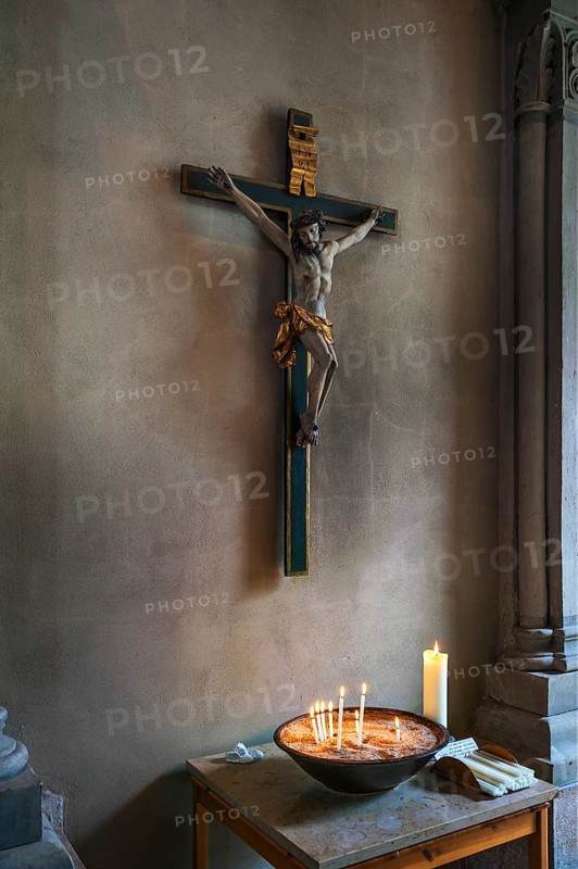 Crucifix and votive candles