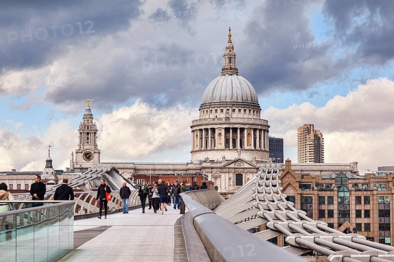 St Paul's Cathedral from the Millennium Bridge with dramatic sky
