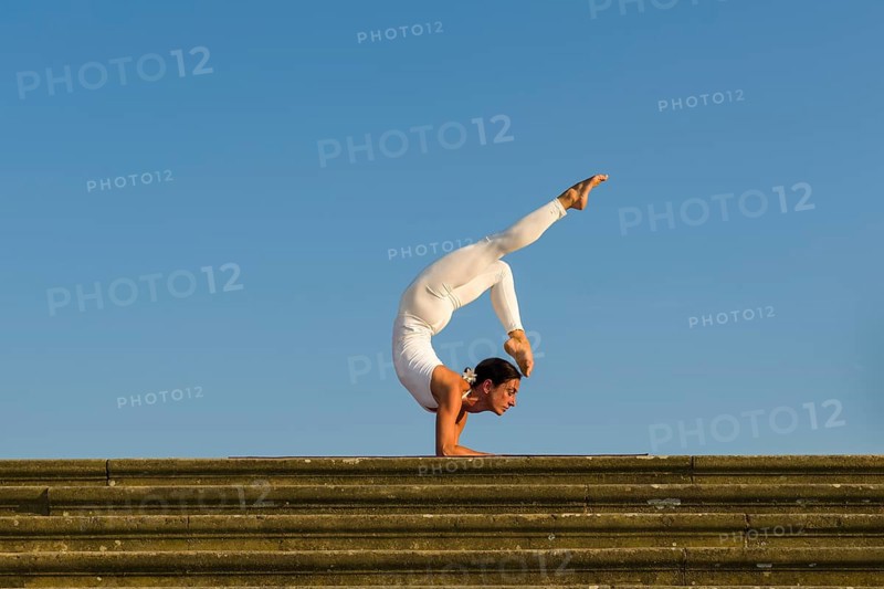 Young woman practising Hatha yoga
