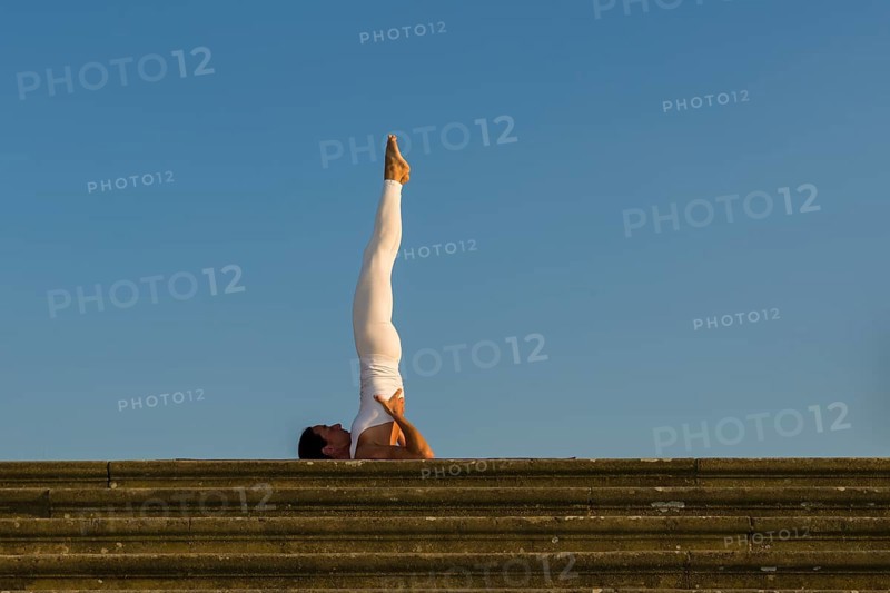 Young woman practising Hatha yoga