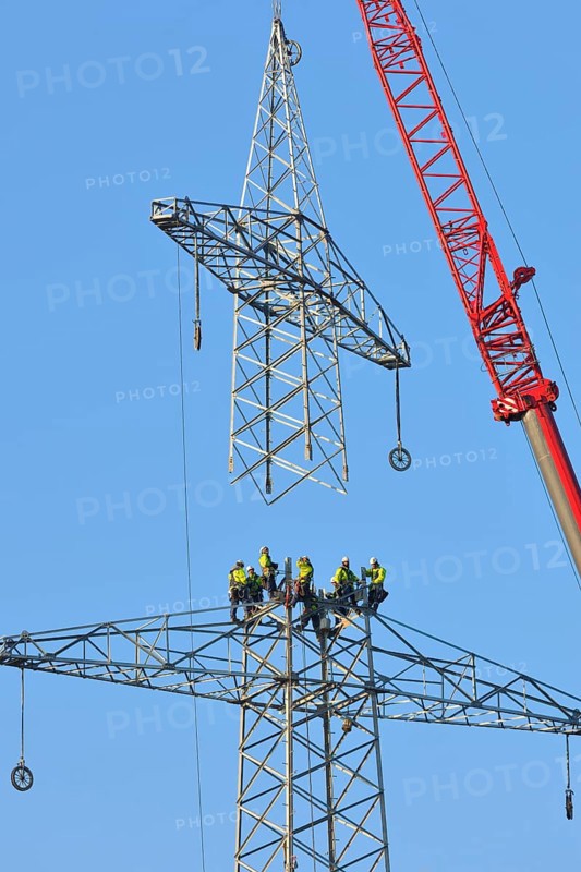 Overhead linemen working on a pylon