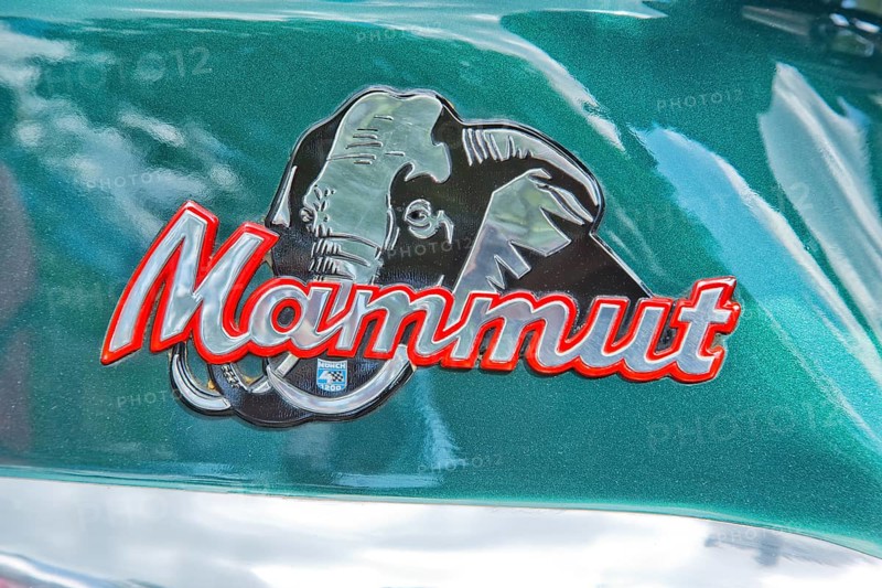 The logo on the motorcycle tank of the Munch 4 Mammut TTS-E