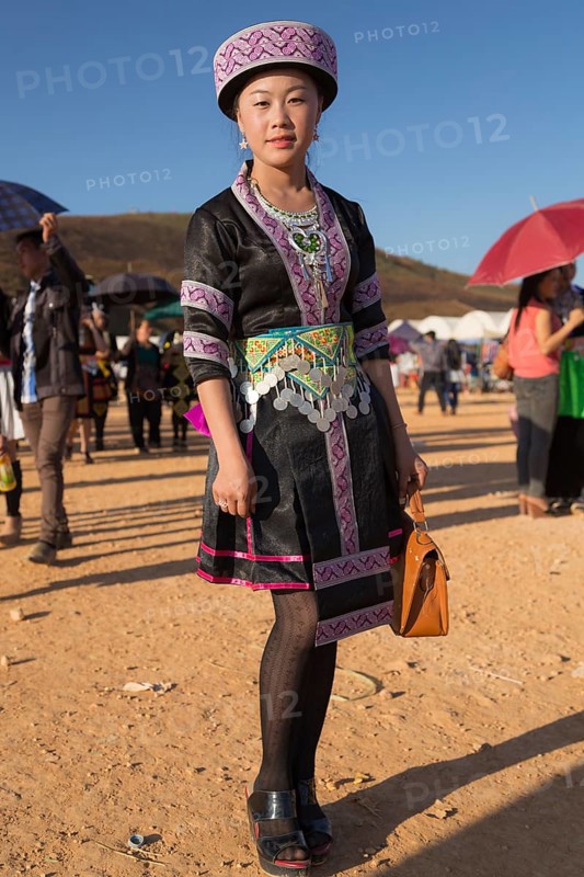 Young woman dressed in a traditional Hmong costume