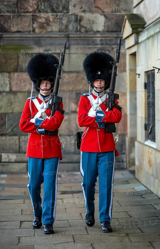 Royal Life Guards in red uniforms in front of Christiansborg Palace