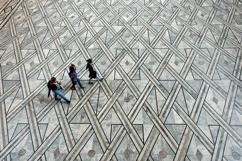 Visitors crossing the Central Hall of the Oslo City Hall