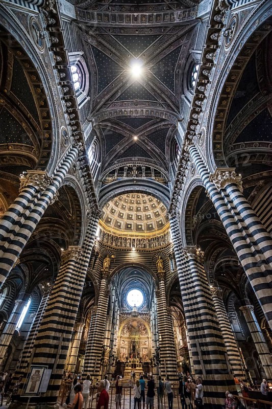 Interior with striped pillars and ornate ceiling