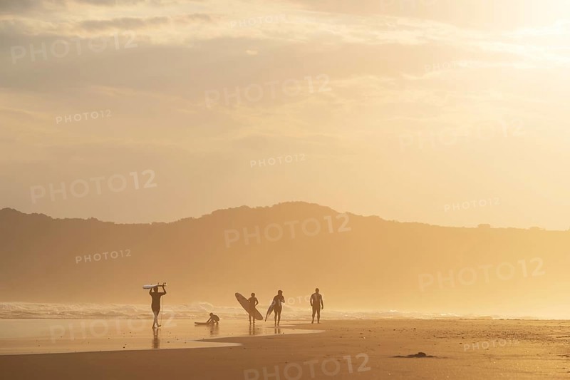Surfer in the evening in backlight