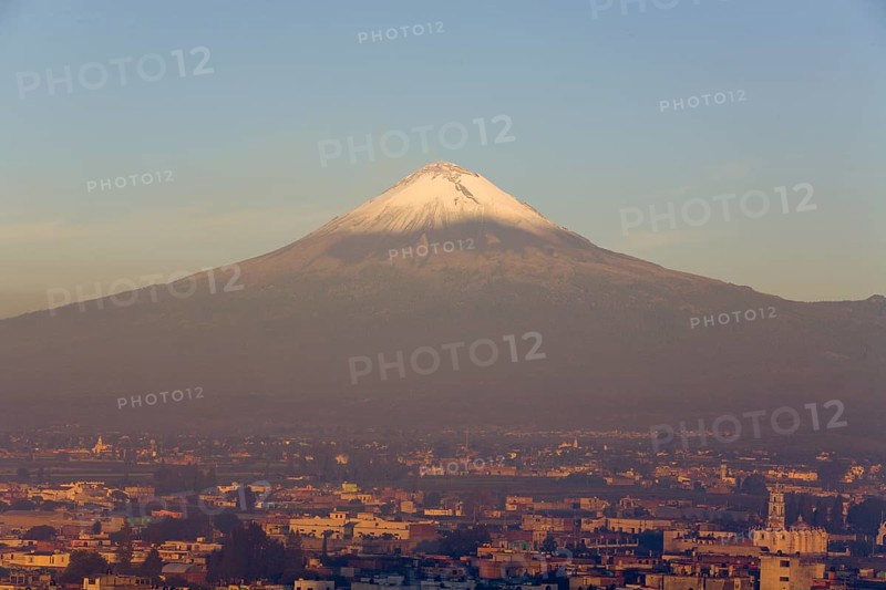 Popocatepetl volcano with the city of Cholula in early morning light