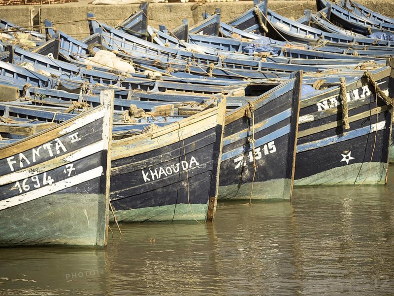 Old blue fishing boats in the port of Essaouira