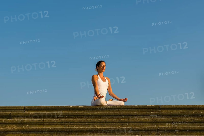 Young woman practising Hatha yoga