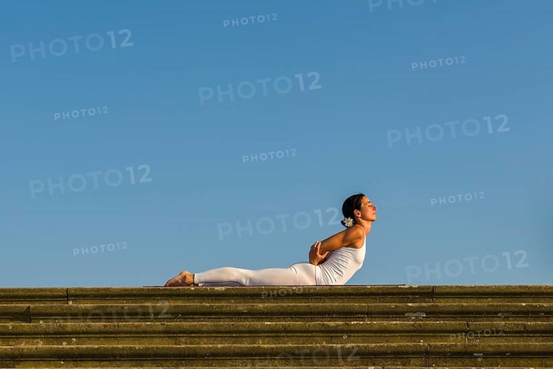 Young woman practising Hatha yoga