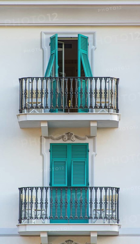 Balconies with turquoise shutters