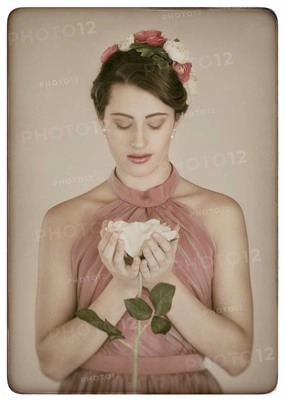 Beauty portrait of a young woman with flowers in her hair