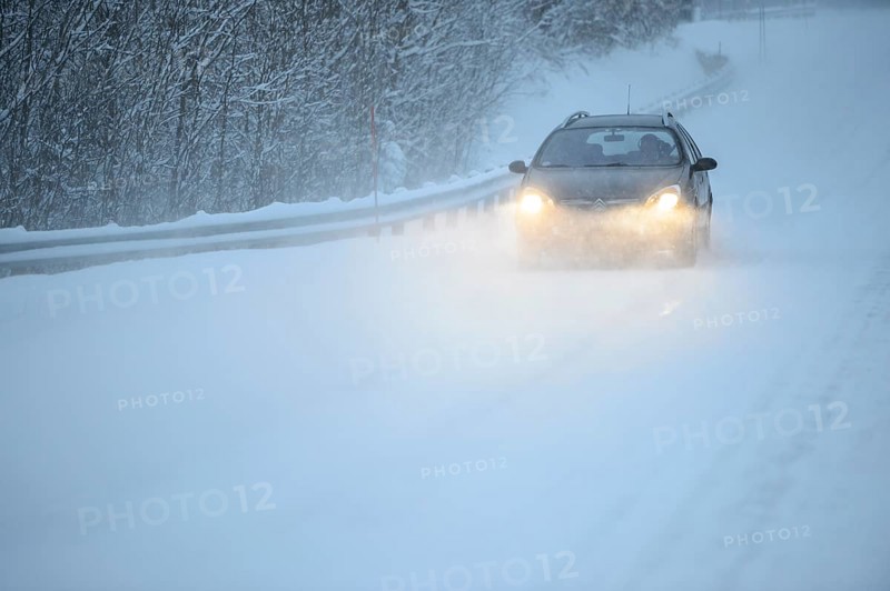 Truck driving on snowy road