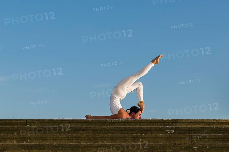 Young woman practising Hatha yoga