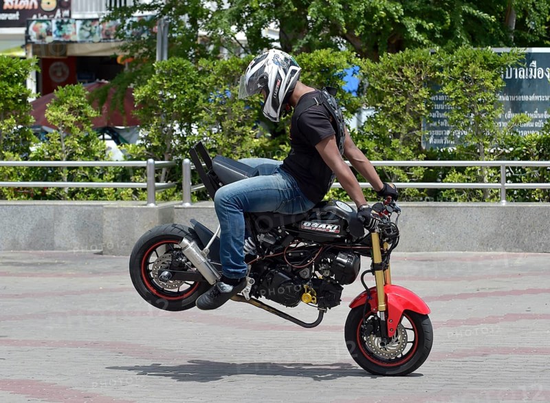 Motorcycle stunt rider performing