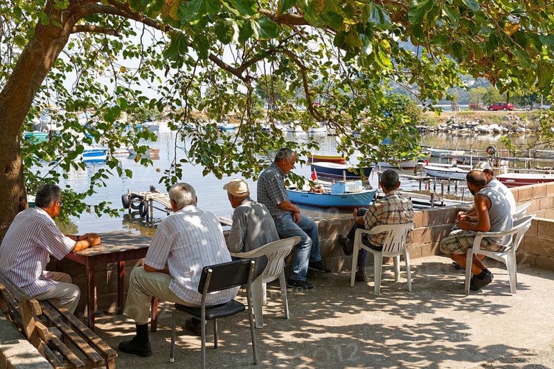 Men relaxing at the fishing port