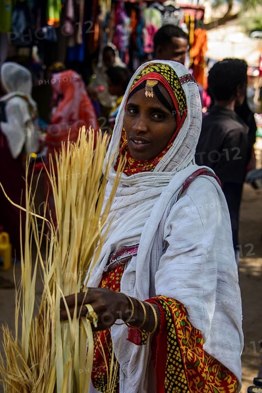Woman shopping on the colourful Monday market of Keren