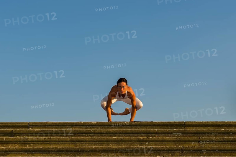 Young woman practising Hatha yoga