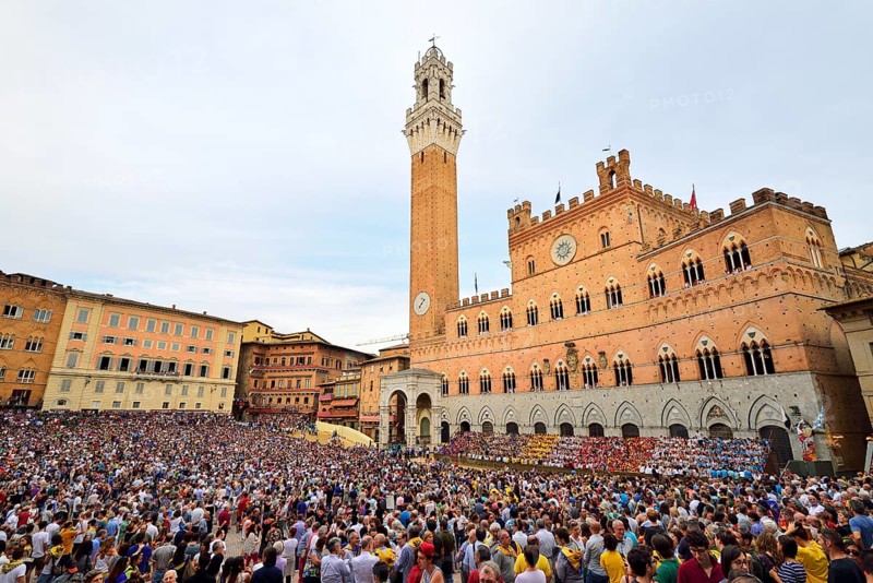 Piazza del Campo with Palazzo Publico on a training day of the Palio di Siena