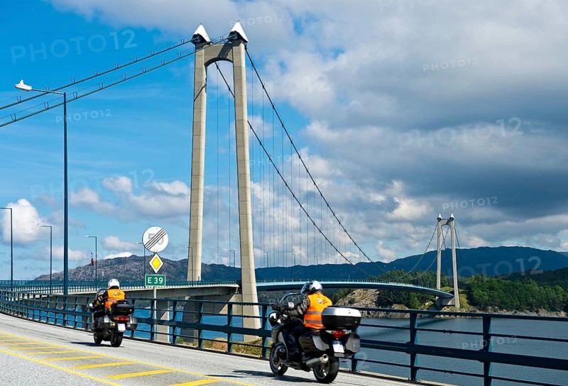 Motorcycles on the European Road E39 at Stord Bridge or Stordabrua suspension bridge across the sound of Digernessundet