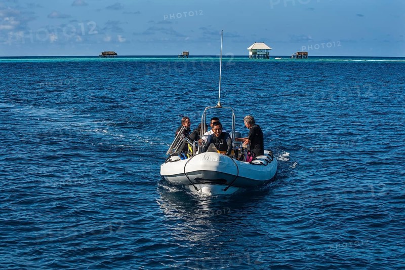Divers in rubber boat