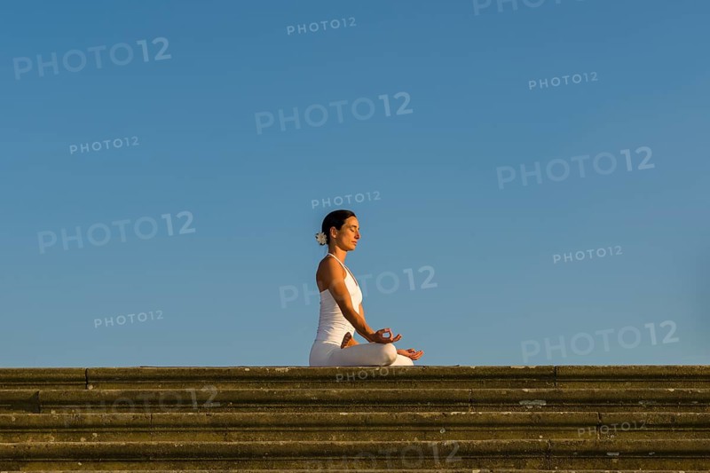 Young woman practising Hatha yoga