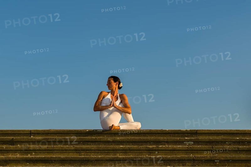 Young woman practising Hatha yoga