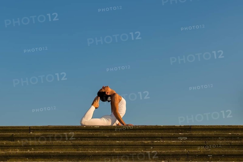 Young woman practising Hatha yoga