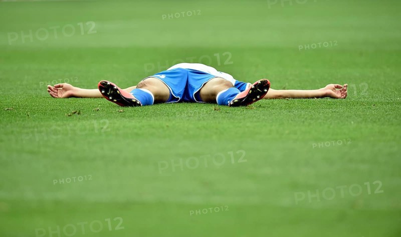Injured football player lying on the ground