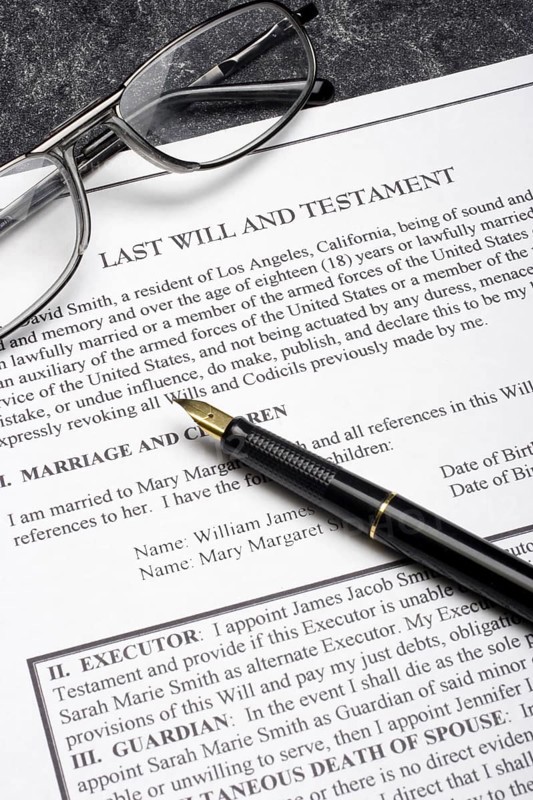 Pen and eyeglasses on a Last Will and Testament document