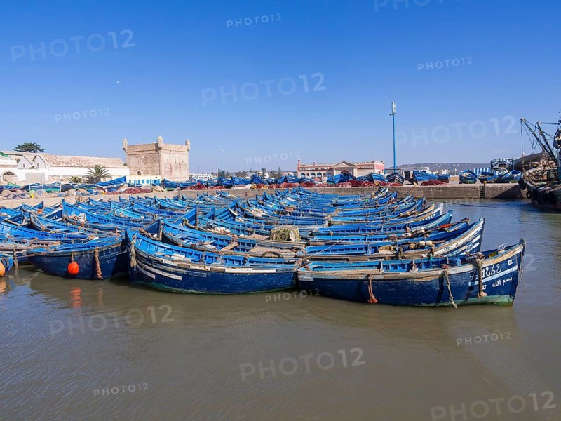 Old blue fishing boats in the port of Essaouira
