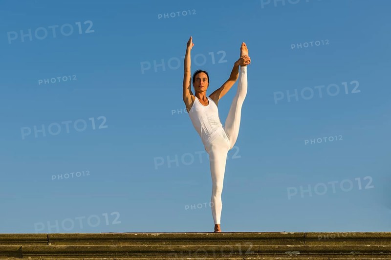 Young woman practising Hatha yoga