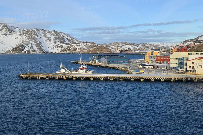 Pier with boat in bay